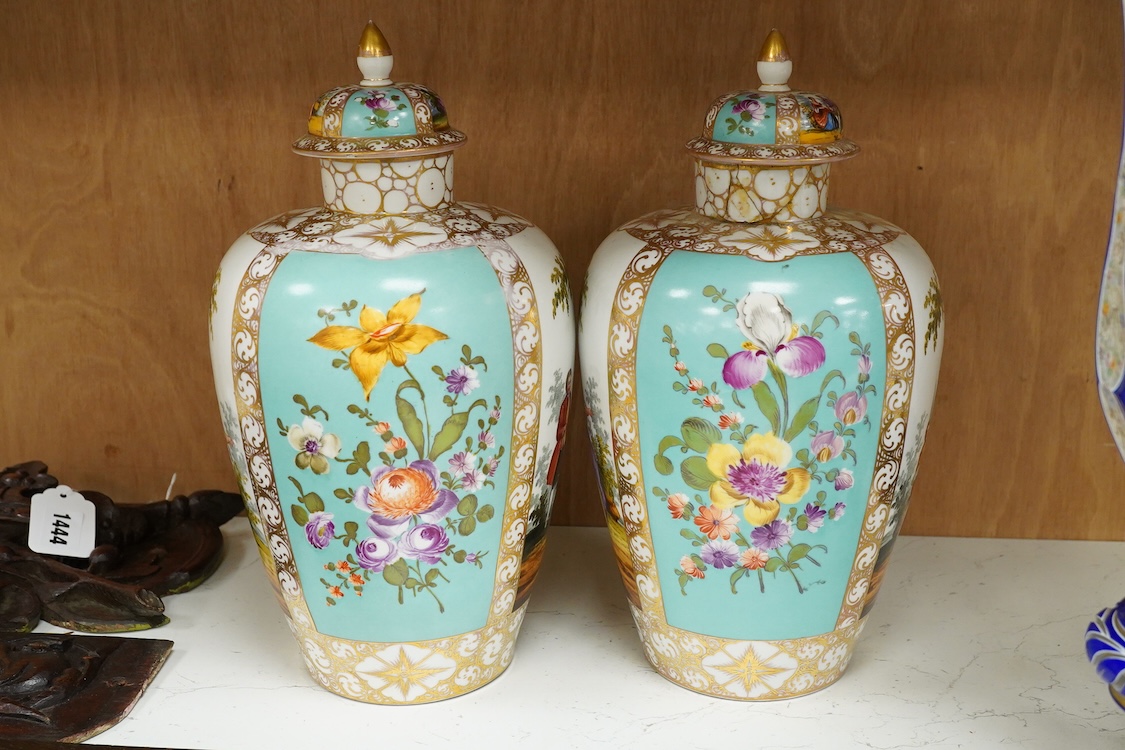 A pair of late 19th century Dresden vases and covers decorated by Helena Wolfsohn, one with damage, 34cm high